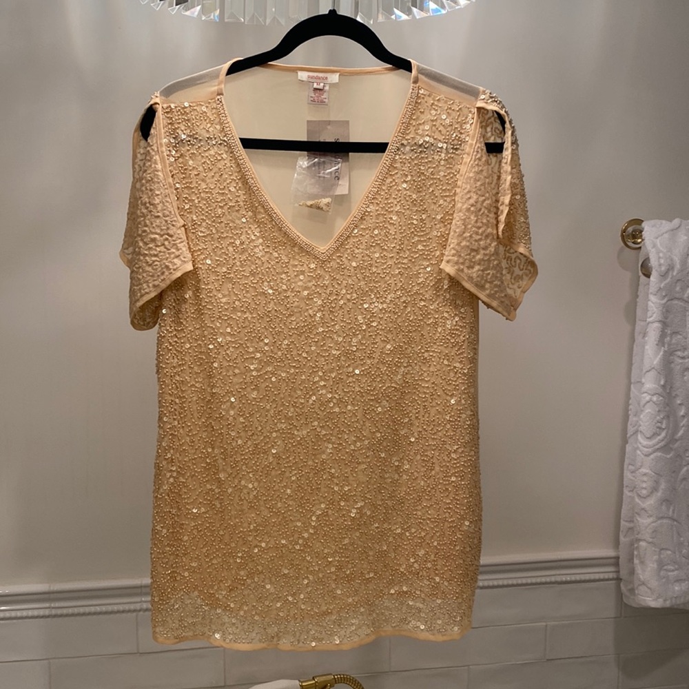 Pretty feminine blouse with sequence. Short sleeves with split.